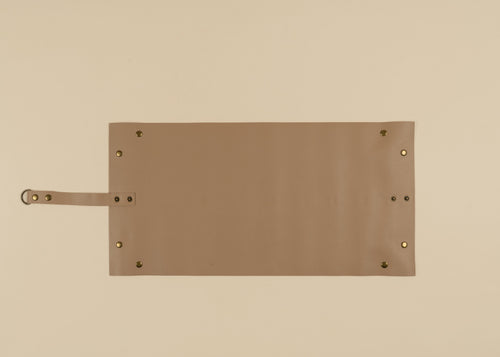 30x60cm in size, A rectangular tan leather pouch or organizer with a strap and brass grommets, displayed flat against a solid beige background.
